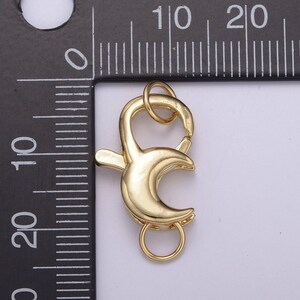 May include: Gold-toned metal lobster clasp with a spring-loaded closure. The clasp is approximately 1 inch in length.