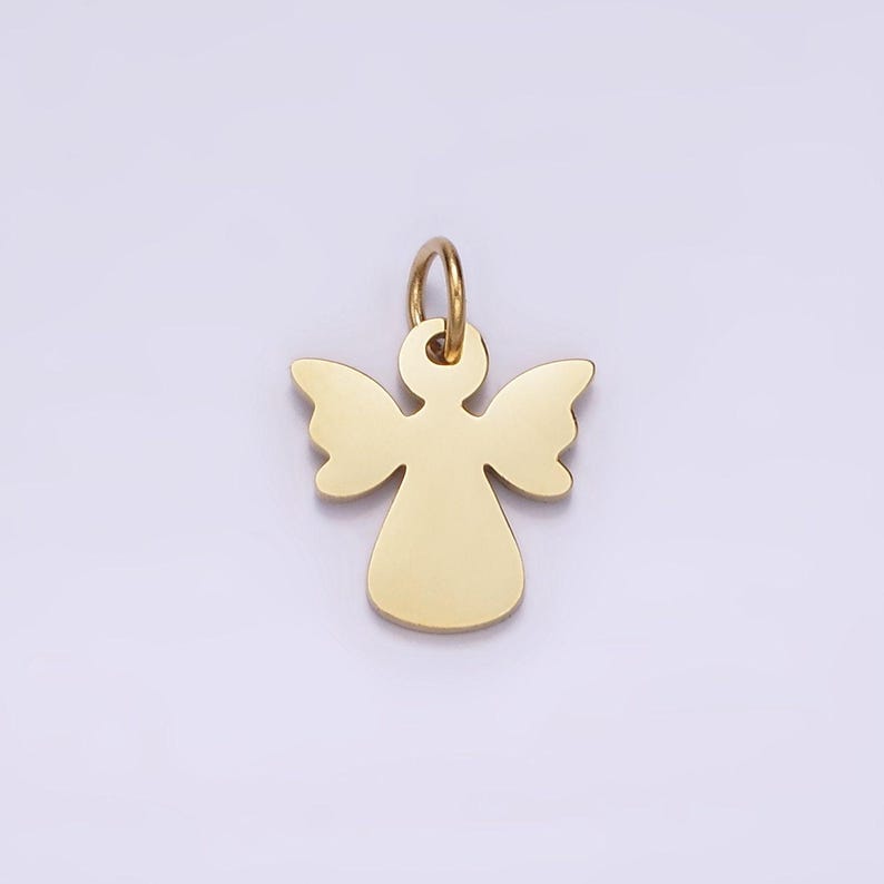 May include: A gold-colored angel charm pendant with a loop for attaching to a necklace or bracelet.
