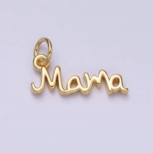 May include: A gold-colored charm pendant in a cursive font that spells "Mama". The charm has a small loop at the top for attaching to a necklace or bracelet. The pendant is likely made of metal and has a shiny finish.