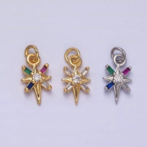 May include: Three gold and silver star-shaped charms with a clear rhinestone in the center and colorful baguette-shaped rhinestones around the center. The charms are perfect for jewelry making.