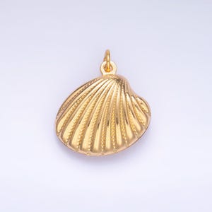May include: A gold-colored seashell charm pendant. The seashell is detailed with a textured surface.