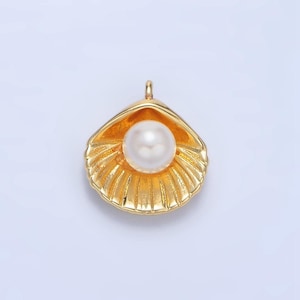 May include: A gold-tone seashell pendant with a white pearl inside. The pendant is a popular design for jewelry making.