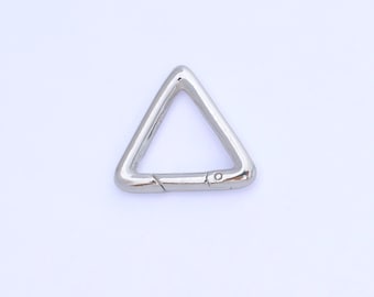 May include: A silver-colored, triangular carabiner clip. The clip is made of metal and has a hinged opening with a small pin. The shape is a perfect equilateral triangle. The background is plain white.