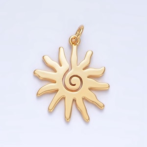 May include: A gold-colored sun pendant with a spiral design in the center. The pendant has a loop at the top for attaching to a chain.