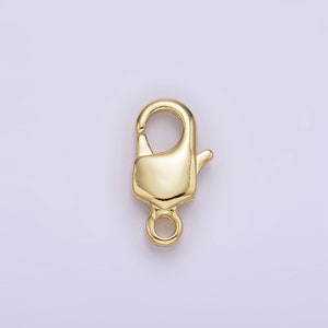 May include: Gold-toned metal lobster clasp with a spring-loaded closure. The clasp is designed for attaching jewelry or other items.