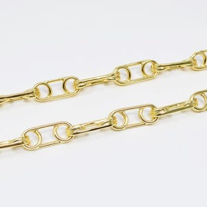 May include: A gold chain necklace with a linked pattern of oval and round shapes.