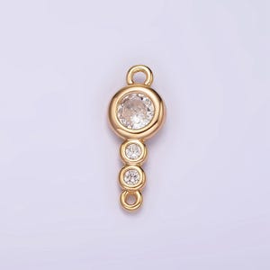 May include: Gold-tone connector with a clear round crystal and three smaller clear round crystals.
