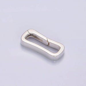 May include: Silver-toned metal clasp with a rectangular shape and a hinged opening.