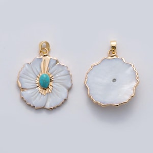 May include: Two flower-shaped pendants with gold-toned metal edges. The left pendant features white mother-of-pearl petals, a central oval turquoise stone, and a gold bail. The right pendant shows the smooth, iridescent white back of the shell.