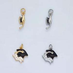 May include: Four graduation cap charms, two gold and two silver. The gold charms have black caps and white "Let's Go" text. The silver charms have black caps.
