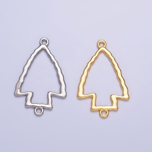 May include: Two metal arrowhead shaped charms, one silver and one gold. Both charms have a loop at the top and bottom for attaching to jewelry.