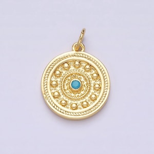 Peut inclure: Pendentif en or avec une pierre turquoise au centre, entourée d'un cercle de petites perles dorées.