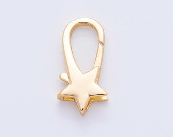 May include: A gold-colored lobster clasp with a star-shaped charm. The clasp is designed to securely fasten jewelry or other accessories. The star charm adds a decorative element to the clasp.