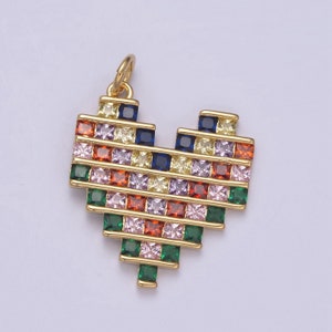 May include: A gold heart-shaped pendant with a colorful mosaic of square-shaped gemstones. The pendant is made of metal and has a loop at the top for attaching to a chain.