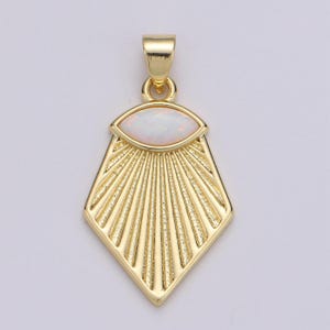 May include: Gold pendant with a white opal gemstone in a sunburst design.