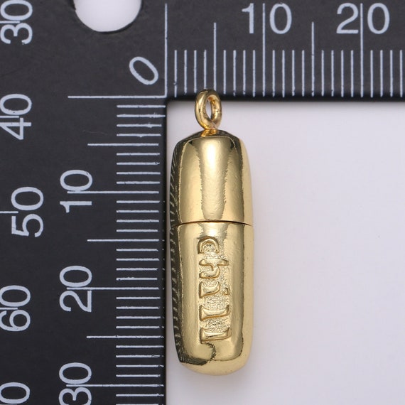 Gold pill necklace best sale