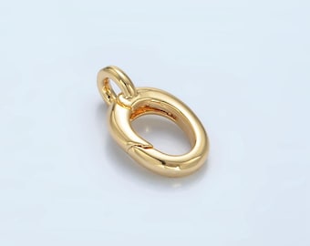 May include: Gold-toned metal oval-shaped clasp with a spring-loaded closure. The clasp is designed for attaching to jewelry chains or cords.