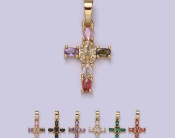 May include: A gold cross pendant with colorful gemstones. The cross is decorated with a variety of oval-shaped stones in shades of pink, purple, green, red, and white.