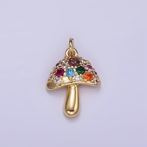 May include: A gold-tone mushroom charm with colorful crystal accents. The charm is perfect for adding a whimsical touch to jewelry projects.