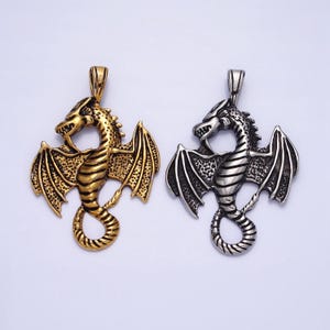 May include: Two dragon pendant necklaces, one gold and one silver, with detailed wings and a coiled tail.