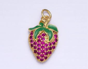 May include: Gold-tone charm featuring a strawberry design with pink and green enamel and clear rhinestones.