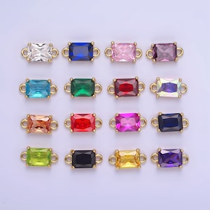 May include: Assortment of 12 colorful rectangular connector charms with gold-toned metal loops. The charms feature various colors including pink, blue, green, red, and purple.