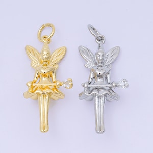 May include: Two fairy charms, one gold-toned and one silver-toned. Each charm features a fairy with detailed wings, a heart-shaped bodice, and a wand. The charms are designed for jewelry making or as decorative elements.