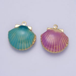 May include: Two gold-tone shell-shaped charms with a hinged opening. One charm is teal blue and the other is pink.
