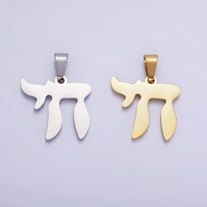 May include: Two pendants, one silver and one gold, shaped like the Hebrew letter Chai.