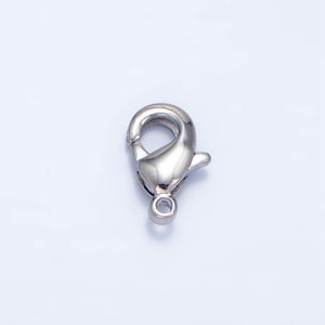 May include: Silver-toned metal lobster clasp for jewellery making. The clasp is a common type of fastener used for necklaces, bracelets, and other jewellery.