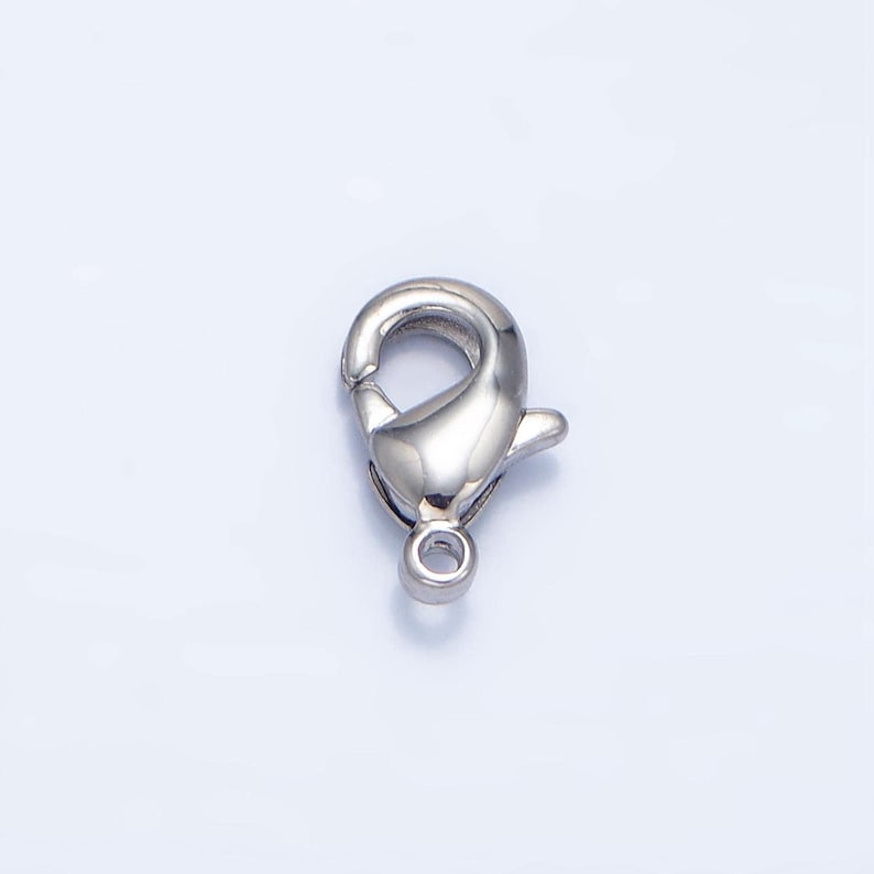 May include: Silver-toned metal lobster clasp for jewellery making. The clasp is a common type of fastener used for necklaces, bracelets, and other jewellery.