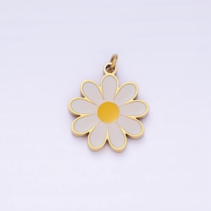 May include: A gold-colored charm in the shape of a white daisy with a yellow center. The charm is perfect for adding a touch of whimsy to jewelry or crafts.