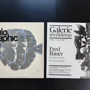 May include: A black and white poster advertising an art exhibition by Fred Bauer at the Galerie im Zielemp. The exhibition features woodcuts and graphics and runs from March 4th to April 1st, 1967.