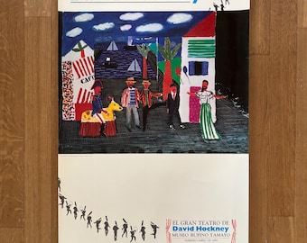 May include: A colorful poster advertising an exhibit of David Hockney's work at the Museo Rufino Tamayo in Mexico City. The poster features a painting of a street scene with people, buildings, and a cafe. The text on the poster reads "El Gran Teatro de David Hockney" and "Museo Rufino Tamayo".