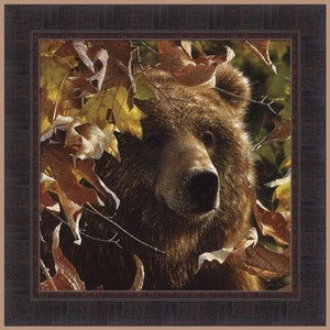 May include: A close-up of a brown bear's face peeking through a thicket of autumn leaves. The bear's fur is a rich brown, and its eyes are dark and intense. The leaves are a mix of red, orange, and yellow, and they create a beautiful contrast against the bear's fur.