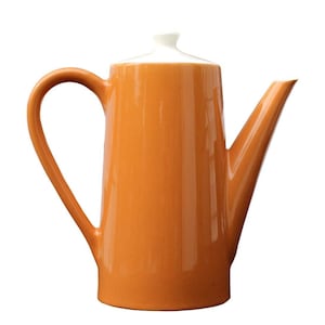 May include: An orange ceramic coffee pot with a white lid. The pot has a curved handle and a long, slender spout. The design is simple and modern, suitable for serving coffee or tea.