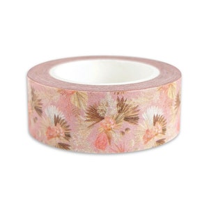 May include: A roll of pink washi tape with a floral pattern featuring dried flowers and leaves. The tape has a subtle shimmer.