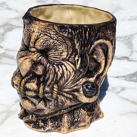 Nomad shrunken head mug in Tanned Tourist!