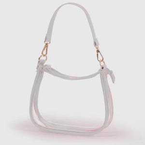 May include: A clear, transparent handbag with a white trim and a pink accent. The bag has a shoulder strap and gold-colored clasps. The bag is designed with a curved shape.