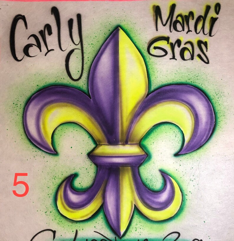May include: A purple and yellow fleur-de-lis design with the words "Carly Mardi Gras" in black script. The number "5" is in red. The background is light green with a speckled effect.