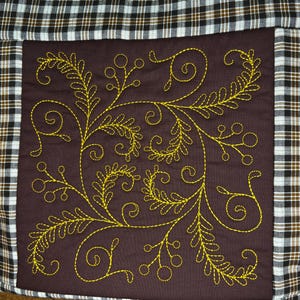 May include: A set of three ceramic mugs with a speckled, matte finish. Each mug features a different color: light blue, cream, and gray. The mugs have a simple, modern design with a rounded shape and a comfortable handle.