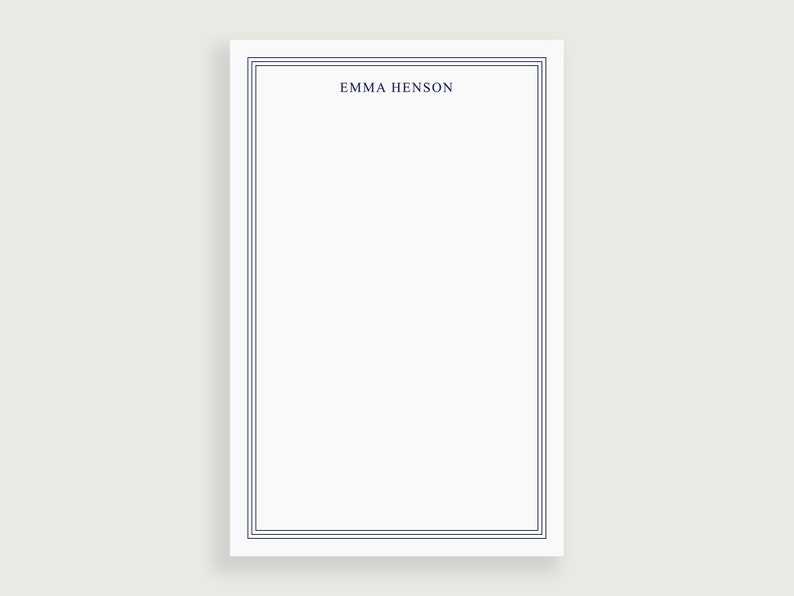 May include: A white stationery card with a blue border and the name "Emma Henson" printed at the top.