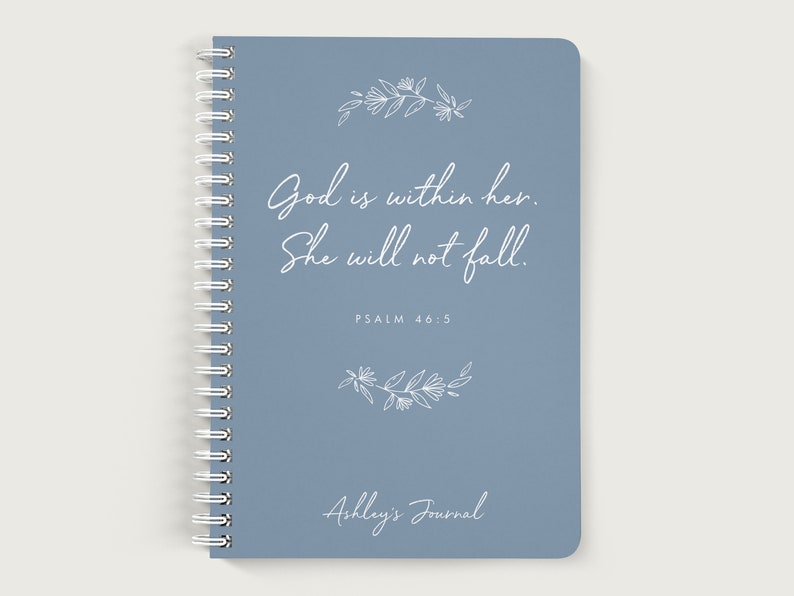 May include: A blue spiral bound journal with the quote "God is within her. She will not fall." and the scripture reference "PSALM 46:5". The journal also has a floral design and the text "Ashley's Journal".