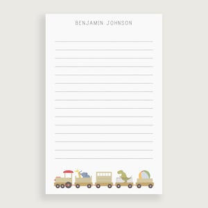May include: A printable stationery sheet with a lined design. The header reads "BENJAMIN JOHNSON". The bottom of the sheet features a cartoon train with a giraffe, elephant, dinosaur, and a beach ball.