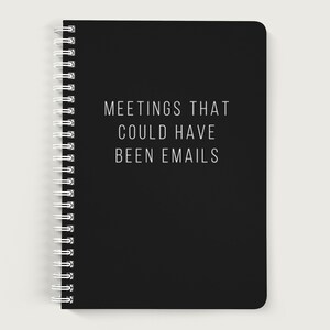 May include: Black spiral bound notebook with the text "MEETINGS THAT COULD HAVE BEEN EMAILS" printed in white.