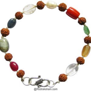 May include: A brown beaded bracelet with various colored gemstones, including a white pearl, red coral, blue sapphire, green emerald, and clear quartz. The bracelet has a silver clasp.