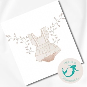 May include: Embroidered design of a white baby onesie with ruffles and a floral vine. The design is in a light brown colour and is surrounded by a white background. The design is labelled "Mermaid Embroidery".