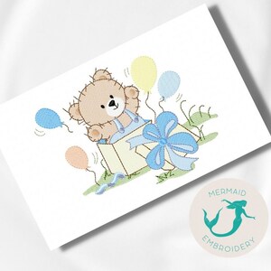 May include: A brown teddy bear pops out of a yellow gift box with a blue bow. The bear is surrounded by blue, yellow, and peach balloons.