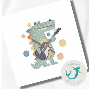 Pode incluir: Desenho bordado de um crocodilo verde tocando guitarra com bolinhas coloridas no fundo. O design é intitulado "Mermaid Embroidery".