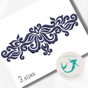 May include: A blue floral embroidery design with intricate swirls and curves. The design is available in three sizes. The image also includes a logo for Mermaid Embroidery.